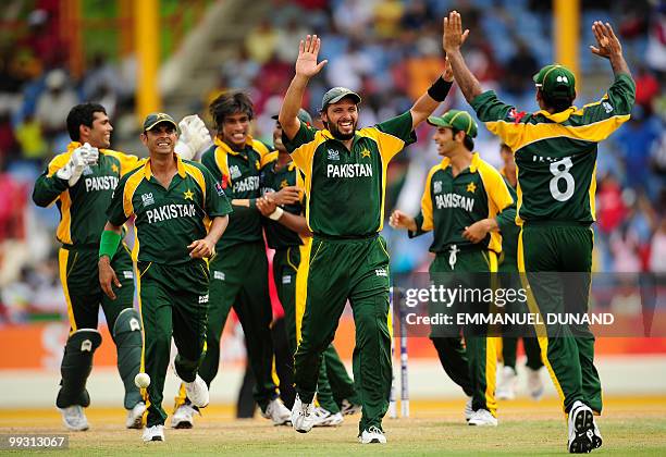 Pakistani captain Shahid Afridi celebrates with his team after the dismissal of Australian batsman Cameron White during the ICC World Twenty20 second...