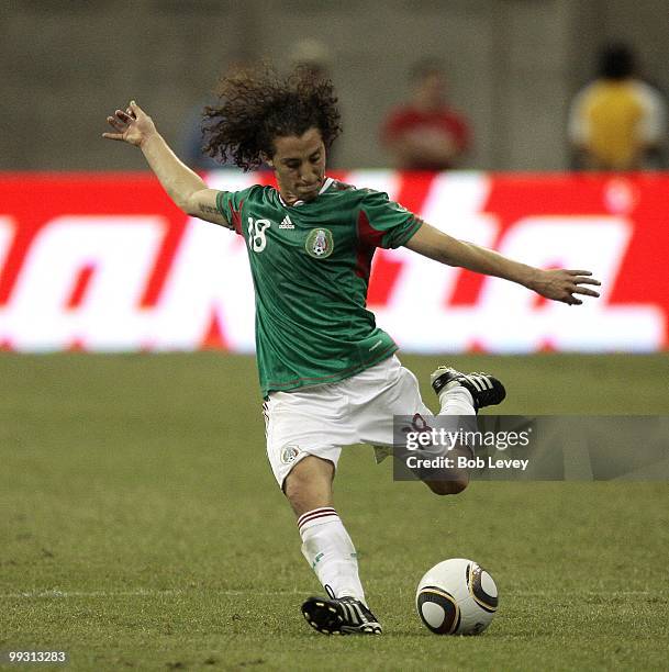 Andres Guardado of Mexico kicks the ball against Angola at Reliant Stadium on May 13, 2010 in Houston, Texas.