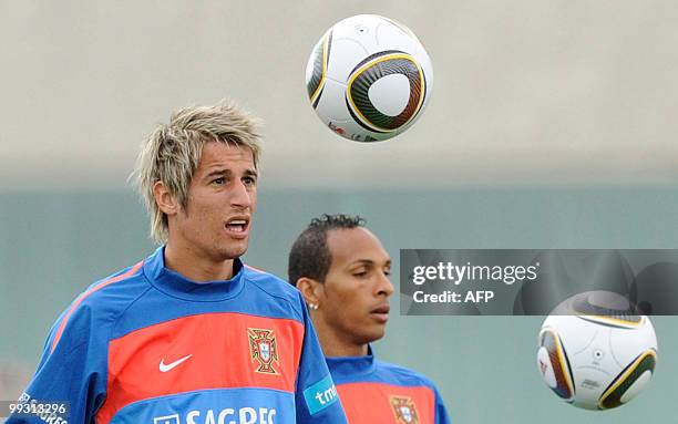 Portugal's midfielder Fabio Coentrao and forward Liedson Muniz practice during the team's training session at Covilha's sports center in Covilha,...