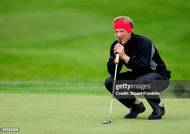 Pelle Edberg of Sweden lines up his putt on the nineth hole during the second round of the Open Cala Millor Mallorca at Pula golf club on May 14,...