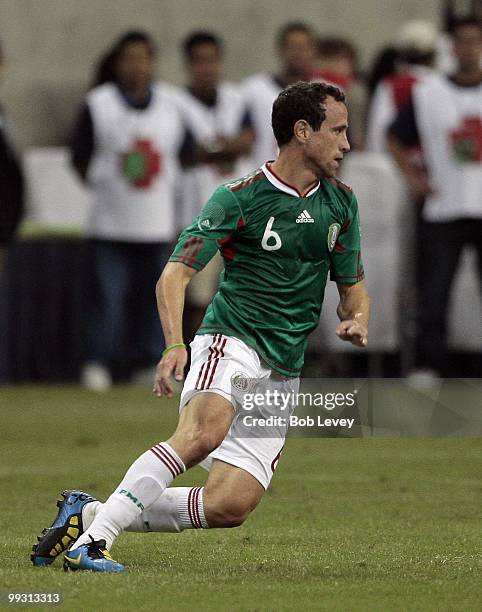 Gerardo Torradoi of Mexico runs against Angola at Reliant Stadium on May 13, 2010 in Houston, Texas.