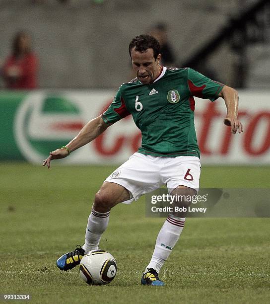 Gerardo Torradoi of Mexico controls the ball against Angola at Reliant Stadium on May 13, 2010 in Houston, Texas.