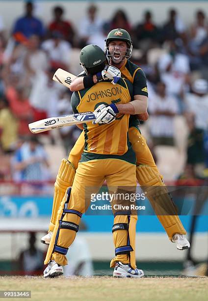 Michael Hussey of Australia celebrates hitting the winning runs with Mitchell Johnson during the ICC World Twenty20 semi final between Australia and...