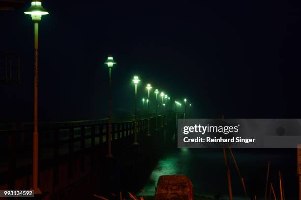 zinnowitz pier at night - zinnowitz stock pictures, royalty-free photos & images