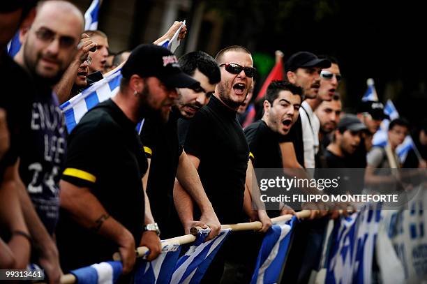 Demonstrators shout slogans during a protest in central Athens, against Turkey's Prime Minister Recep Tayyip Erdogan visit in Greece, on May 14,...