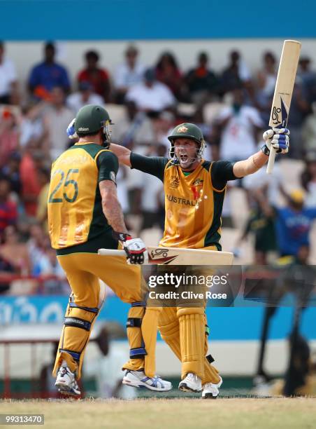 Michael Hussey of Australia celebrates hitting the winning runs with Mitchell Johnson during the ICC World Twenty20 semi final between Australia and...