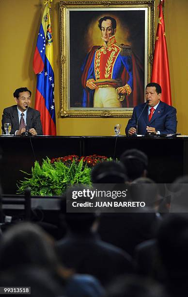 Venezuelan President Hugo Chavez delivers a speech next to the Chinese ambassador to Venezuela, Zhau Rongxian, during a ceremony with a...