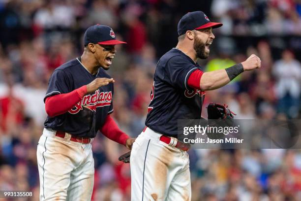 Shortstop Francisco Lindor and second baseman Jason Kipnis of the Cleveland Indians celebrate after a reviewed call is overturned in their favor...