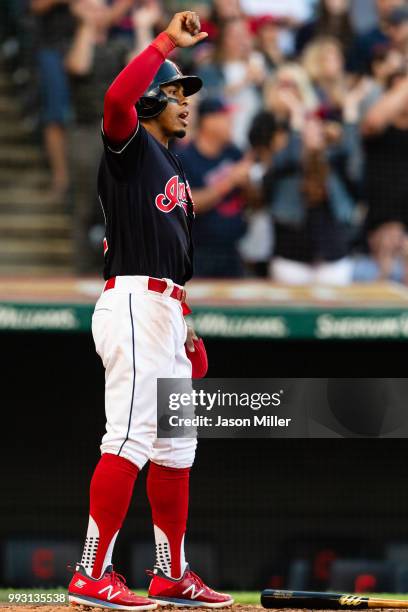 Francisco Lindor of the Cleveland Indians celebrates after scoring on a double by Jose Ramirez during the third inning against the Oakland Athletics...