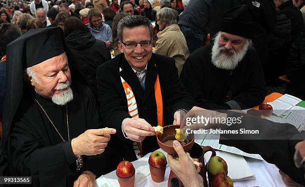 German home secretary Thomas de Maiziere participates in the celebration of Greek orthodox vespers during day 3 of the 2nd Ecumenical Church Day at...