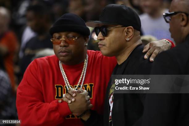 Actor LL Cool J and recording artist E-40 attend week three of the BIG3 three on three basketball league game at ORACLE Arena on July 6, 2018 in...