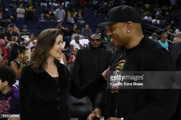 Oakland Mayor Libby Schaaf speaks with actor LL Cool J during week three of the BIG3 three on three basketball league game at ORACLE Arena on July 6,...