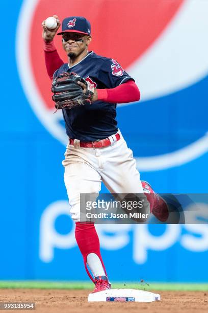 Shortstop Francisco Lindor of the Cleveland Indians throws out Marcus Semien of the Oakland Athletics at first during the ninth inning at Progressive...