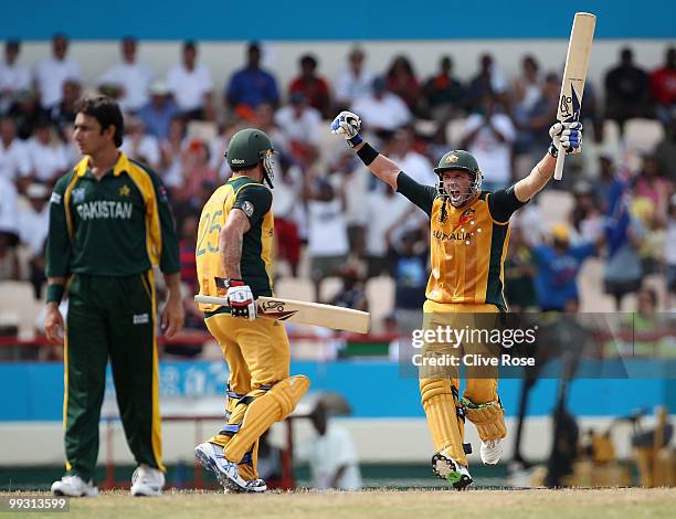 Michael Hussey of Australia celebrates hitting the winning runs with Mitchell Johnson during the ICC World Twenty20 semi final between Australia and...