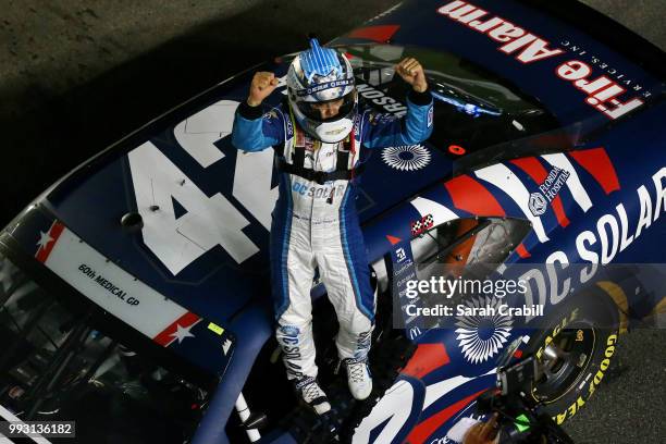 Kyle Larson, driver of the DC Solar Chevrolet, celebrates after winning the NASCAR Xfinity Series Coca-Cola Firecracker 250 at Daytona International...