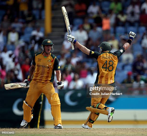 Michael Hussey runs to Mitchell Johnson after Australia beat Pakistan in the semi final of the ICC World Twenty20 at the Beausejour Cricket Ground on...