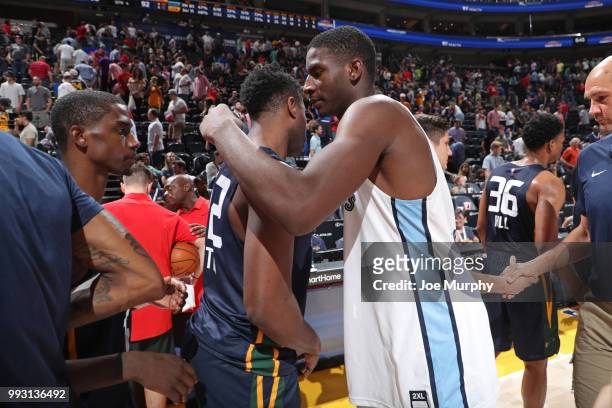 Kelan Martin of the Utah Jazz shakes hands with Jaren Jackson Jr. #13 of the Memphis Grizzlies after the game on July 3, 2018 at Vivint Smart Home...