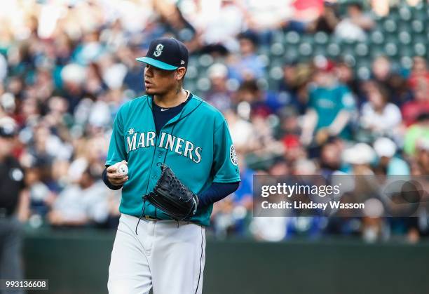 Felix Hernandez of the Seattle Mariners reacts after giving up a home run in the first inning against the Colorado Rockies at Safeco Field on July 6,...