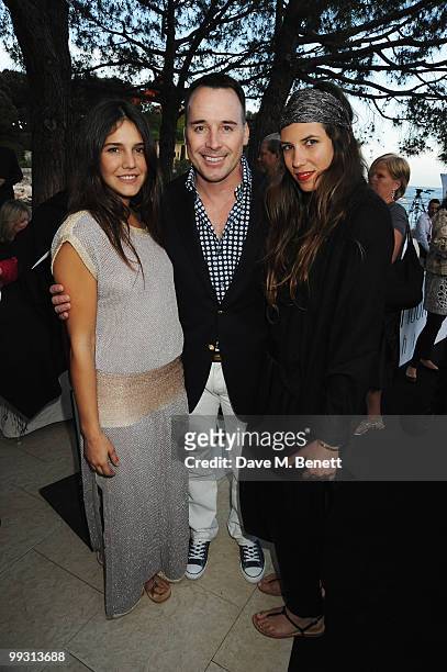 Margherita Missoni and friend are seen with David Furnish as they attend the Amber Fashion Show and Auction held at the Meridien Beach Plaza on May...