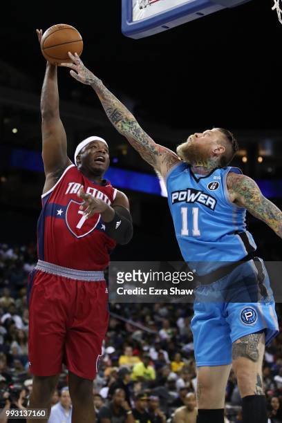 Chris Andersen of Power blocks a shot by Jermain O'Neal of Tri State during week three of the BIG3 three on three basketball league game at ORACLE...