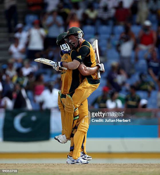 Michael Hussey jumps into the arms of Mitchell Johnson after Australia beat Pakistan in the semi final of the ICC World Twenty20 at the Beausejour...