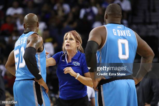 Head coach Nancy Lieberman of Power speaks with Glen Davis and Corey Maggette during their game against Tri State during week three of the BIG3 three...