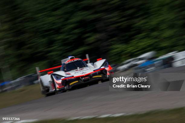 The Acura DPi of Dane Cameron and Juan Pablo Montoya, of Colombia races on the track during practice for the IMSA WeatherTech Series race at Canadian...