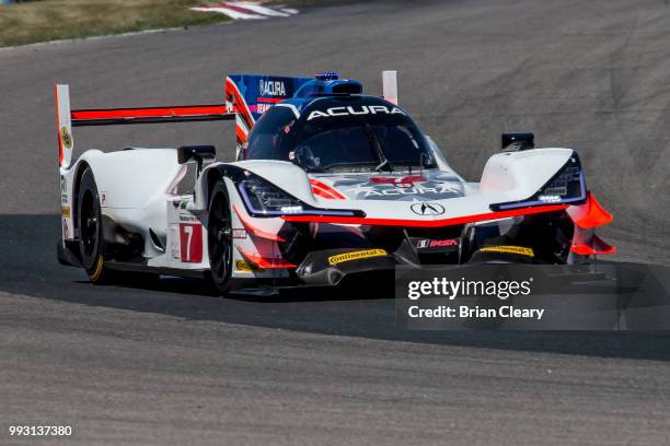 The Acura DPi of Ricky Taylor and Helio Castroneves, of Brazil, races on the track during practice for the IMSA WeatherTech Series race at Canadian...