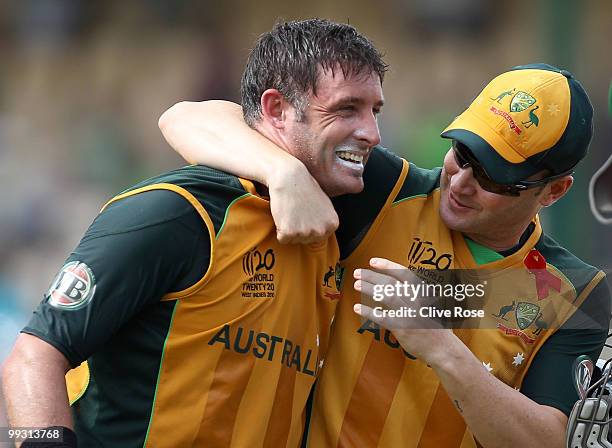 Michael Hussey of Australia celebrates with Michael Clarke after the ICC World Twenty20 semi final between Australia and Pakistan at the Beausjour...