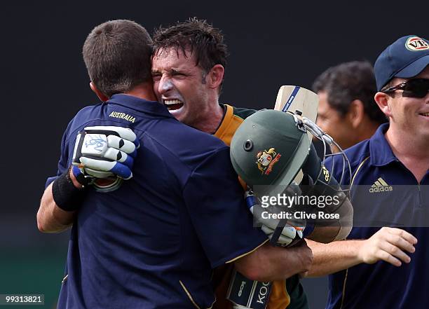 Michael Hussey of Australia celebrates with team members after the ICC World Twenty20 semi final between Australia and Pakistan at the Beausjour...
