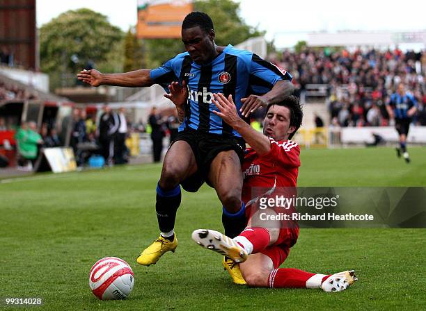 Lloyd Sam of Charlton is tackled by Alan Sheehan of Swindon during the Coca-Cola League One Playoff Semi Final 1st leg match between Swindon Town and...