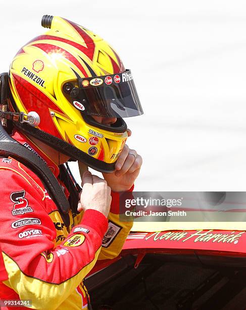 Kevin Harvick, driver of the Shell/Pennzoil Chevrolet, stands on the grid during qualifying for the NASCAR Sprint Cup Series Autism Speaks 400 at...