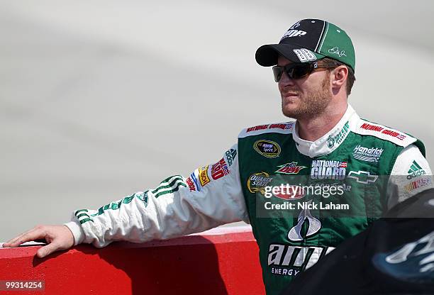 Dale Earnhardt Jr., driver of the AMP Energy/National Guard Chevrolet, stands on the grid during qualifying for the NASCAR Sprint Cup Series Autism...