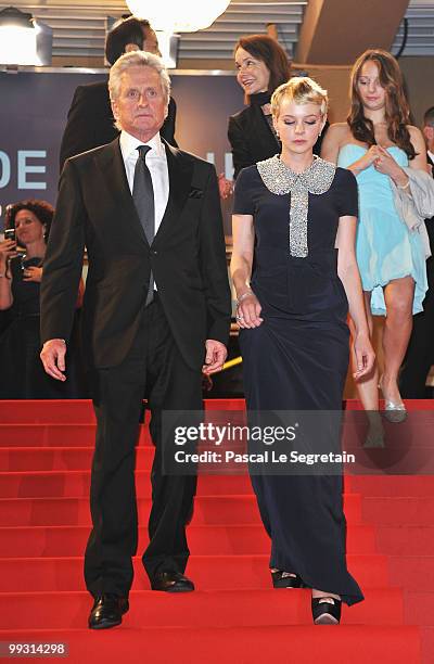 Carey Mulligan and Michael Douglas walk down the steps after the "Wall Street: Money Never Sleeps" Premiere at the Palais des Festivals during the...