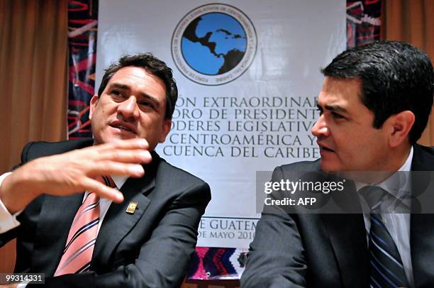 Senate presidents Juan Hernandez of Honduras and Roberto Alejos of Guatemala , talk during a press conference before a meeting of the presidents of...