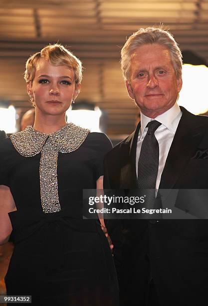 Carey Mulligan and Michael Douglas stand at the top of the steps after the "Wall Street: Money Never Sleeps" Premiere at the Palais des Festivals...