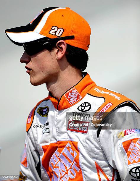 Joey Logano, driver of the The Home Depot Toyota, stands on the grid during qualifying for the NASCAR Sprint Cup Series Autism Speaks 400 at Dover...