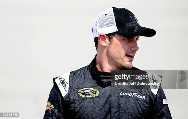Casey Mears, driver of the Red Bull Toyota, stands on the grid during qualifying for the NASCAR Sprint Cup Series Autism Speaks 400 at Dover...