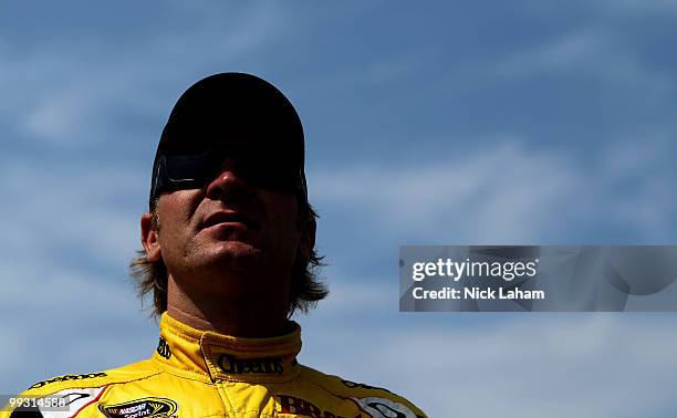 Clint Bowyer, driver of the Cheerios/Hamburger Helper Chevrolet, stands on the grid during qualifying for the NASCAR Sprint Cup Series Autism Speaks...