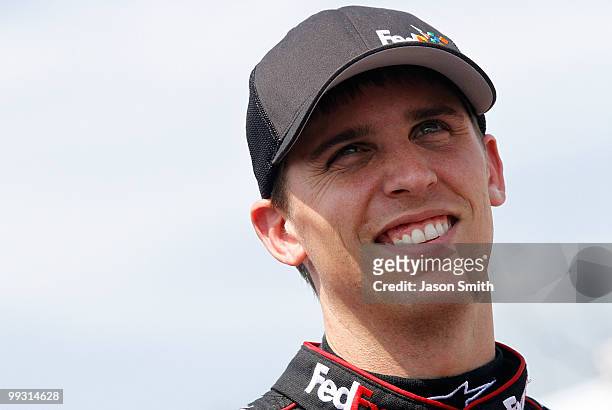 Denny Hamlin, driver of the FedEx Freight Toyota, stands on the grid during qualifying for the NASCAR Sprint Cup Series Autism Speaks 400 at Dover...