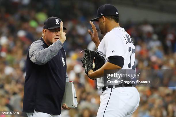 Joe Jimenez of the Detroit Tigers celebrates a 3-1 win over the Texas Rangers with manger Ron Gardenhire at Comerica Park on July 6, 2018 in Detroit,...