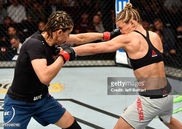 Roxanne Modafferi and Barb Honchak trade punches in their women's flyweight bout during The Ultimate Fighter Finale event inside The Pearl concert...