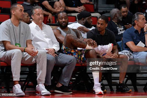 Kentucky's John Calipari and John Wall of the Washington Wizards look on during game between Cleveland Cavaliers and Washington Wizards during the...