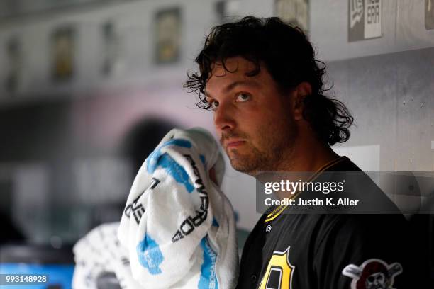 Josh Smoker of the Pittsburgh Pirates looks on from the dugout after being relieved in the seventh inning against the Philadelphia Phillies at PNC...