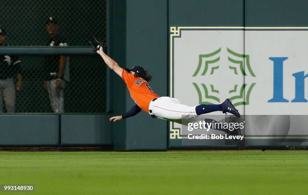 Jake Marisnick of the Houston Astros makes a diving catch on a line drive by Adam Engel of the Chicago White Sox in the eighth inning at Minute Maid...