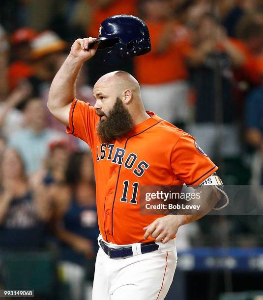 Evan Gattis of the Houston Astros hits a three-run home run in the eighth inning against the Chicago White Sox at Minute Maid Park on July 6, 2018 in...