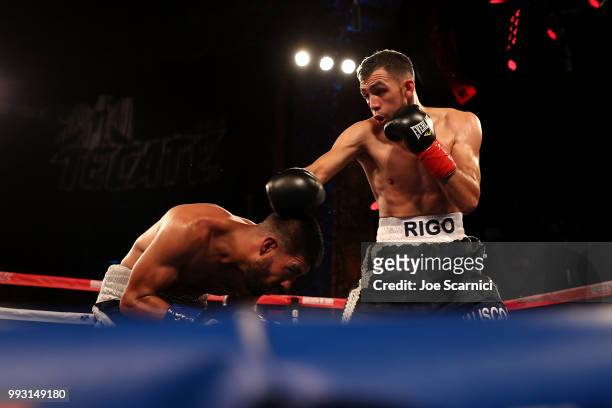 Rigoberto Hermosillo connects a punch to Ernesto Guerrero during the Super Featherweight fight in the third round of LA Fight Club at The Belasco...