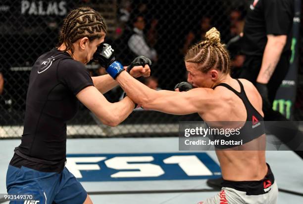 Barb Honchak punches Roxanne Modafferi in their women's flyweight bout during The Ultimate Fighter Finale event inside The Pearl concert theater at...