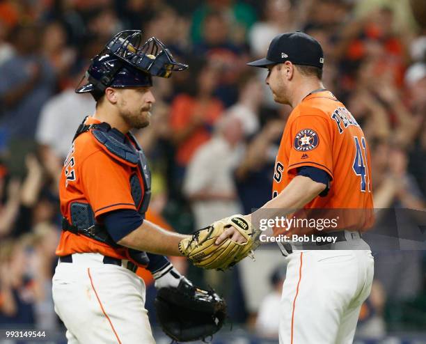 Brad Peacock of the Houston Astros shakes hands with Tim Federowicz after the final out against the Chicago White Sox at Minute Maid Park on July 6,...