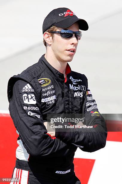 Brad Keselowski, driver of the Penske Dodge Dodge, stands on the grid during qualifying for the NASCAR Sprint Cup Series Autism Speaks 400 at Dover...